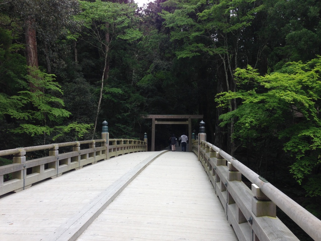 The sacred bridge at Ise Grand Shrine — Japan's most sacred site — leading into ancient cedar forest
